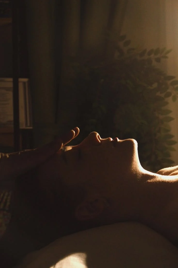 A person resting in an intimate space of care and stillness