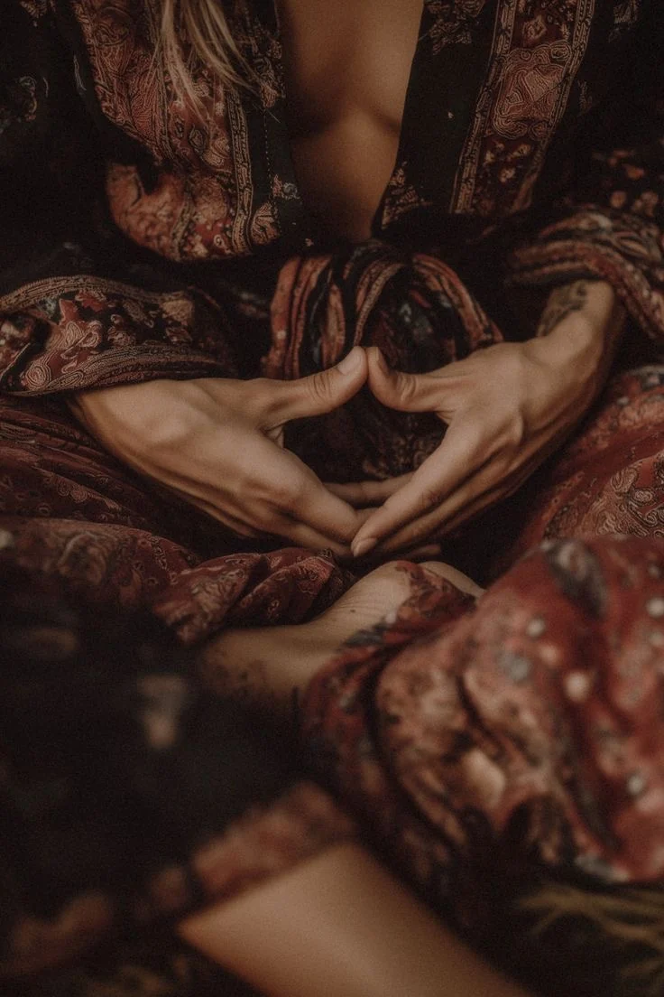 Hands in a contemplative gesture, evoking inner wisdom, memory, and lineage