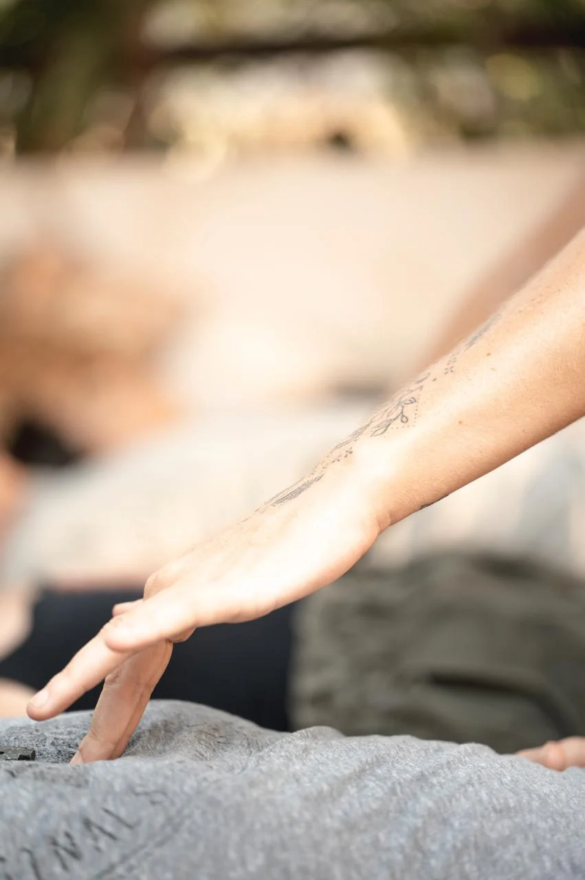 A hand offering support during a session